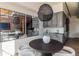 Chic dining area with modern lighting, gray cabinets, and reflective mirror accent wall at 1720 Wynkoop St # Ph403, Denver, CO 80202