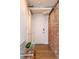 Welcoming entryway featuring a brick accent wall and modern decor at 1720 Wynkoop St # Ph403, Denver, CO 80202