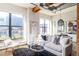 Bright living room featuring exposed ductwork, large windows, and stylish modern furnishings at 1720 Wynkoop St # Ph403, Denver, CO 80202