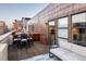 Inviting rooftop deck features outdoor seating, a grill, and sliding glass doors, perfect for entertaining and enjoying city views at 1720 Wynkoop St # Ph403, Denver, CO 80202