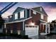 New construction home featuring a two-car garage, welcoming porch, and craftsman-style details at 22392 E 38Th Pl, Aurora, CO 80019