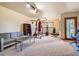 Spacious basement with a sitting area, gym, and bright natural light at 2012 Tournament Ct, Evergreen, CO 80439