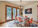 Dining room with doors to the deck; bathed in natural light at 2012 Tournament Ct, Evergreen, CO 80439