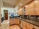 Kitchen with granite countertops, stainless appliances, and wood cabinets at 2012 Tournament Ct, Evergreen, CO 80439