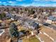 Expansive aerial view of a neighborhood with mountain views, showcasing the community and surrounding scenery at 7862 W Euclid Pl, Littleton, CO 80123