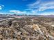 Wide aerial panorama featuring homes in a well-planned neighborhood, a few patches of snow remain at 7862 W Euclid Pl, Littleton, CO 80123