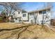 This backyard showcases a patio and a swing set, offering potential for Gathering activities at 7862 W Euclid Pl, Littleton, CO 80123