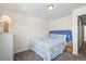 Cozy bedroom with a patterned quilt, dresser, and nightstand creating a comfortable and restful retreat at 7862 W Euclid Pl, Littleton, CO 80123