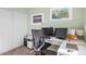 This bedroom is a functional workspace with a modern desk setup and bright, neutral decor at 7862 W Euclid Pl, Littleton, CO 80123