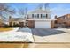 Charming two-story home with a well-maintained lawn, showcasing its classic architecture and welcoming curb appeal at 7862 W Euclid Pl, Littleton, CO 80123