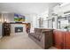 Inviting living room featuring a fireplace and a comfortable seating arrangement at 7862 W Euclid Pl, Littleton, CO 80123