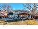 Covered patio with outdoor kitchen and dining area at 7913 Grasmere Dr, Boulder, CO 80301