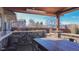 Covered patio with bar and seating area, offering mountain views at 7913 Grasmere Dr, Boulder, CO 80301