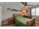 Cozy bedroom with mountain mural and wooden furniture at 7913 Grasmere Dr, Boulder, CO 80301