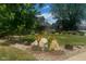 Well-manicured front yard with landscaping and large rocks at 7913 Grasmere Dr, Boulder, CO 80301