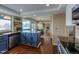 Spacious kitchen featuring granite countertops, stainless steel appliances, and blue cabinetry at 7913 Grasmere Dr, Boulder, CO 80301