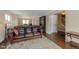 Living room with leather couches and hardwood floors at 7913 Grasmere Dr, Boulder, CO 80301