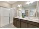Modern bathroom features double sinks, a large mirror, and a glass-enclosed shower at 4621 Cattle Cross Trl, Castle Rock, CO 80104