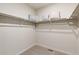 Walk-in closet with carpet flooring and shelving for ample storage at 4621 Cattle Cross Trl, Castle Rock, CO 80104