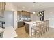 Well-equipped kitchen featuring stainless appliances, white countertops, and island seating at 4621 Cattle Cross Trl, Castle Rock, CO 80104