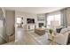 Bright living room showcasing a fireplace, comfortable seating, and access to a cozy bedroom at 4621 Cattle Cross Trl, Castle Rock, CO 80104