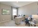 Well-lit home office with a modern desk, comfortable seating, and a serene workspace at 4621 Cattle Cross Trl, Castle Rock, CO 80104