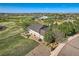 Aerial view of home with lush landscaping and mature trees near a golf course and neighborhood amenities at 15333 Heritage Cir, Thornton, CO 80602