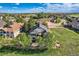 Gorgeous aerial view of home with manicured lawn, mature trees, and a well-maintained yard in a golf community at 15333 Heritage Cir, Thornton, CO 80602