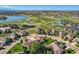 Breathtaking aerial view of golf course community with ponds, lush landscaping, and beautiful homes at 15333 Heritage Cir, Thornton, CO 80602