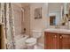 Functional bathroom with a tiled shower-tub combination, toilet, and vanity sink at 15333 Heritage Cir, Thornton, CO 80602