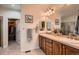 Bathroom features double sinks, wooden cabinets, tile flooring and closet space at 15333 Heritage Cir, Thornton, CO 80602