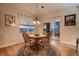 Cozy dining area features a round table with seating for four and scenic views at 15333 Heritage Cir, Thornton, CO 80602
