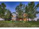 Rear exterior featuring a multi-level deck and scenic views, perfect for outdoor living at 15333 Heritage Cir, Thornton, CO 80602