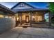 Inviting front porch with craftsman columns and front door with decorative glass at 15333 Heritage Cir, Thornton, CO 80602