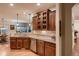 Well-lit kitchen featuring granite countertops, stainless steel appliances, and wooden cabinetry at 15333 Heritage Cir, Thornton, CO 80602