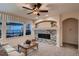 Living room showcasing a stylish fireplace and large windows offering outdoor views at 15333 Heritage Cir, Thornton, CO 80602
