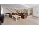 Spacious finished basement with comfortable seating, foosball table and natural light, perfect for entertainment and relaxation at 11398 Ranch Elsie Rd, Golden, CO 80403