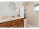 Bright bathroom featuring a sink with stylish fixtures and a convenient shower, perfect for guests and everyday use at 11398 Ranch Elsie Rd, Golden, CO 80403