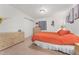 Cozy bedroom featuring neutral carpet, light wood furniture, a double closet, and soft, natural lighting at 11398 Ranch Elsie Rd, Golden, CO 80403