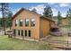 Charming home featuring a fenced yard, a well-maintained lawn, and mountain views at 11398 Ranch Elsie Rd, Golden, CO 80403