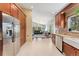 Open kitchen layout featuring stainless steel appliances and granite countertops with an open view to living area at 11398 Ranch Elsie Rd, Golden, CO 80403