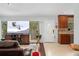 Bright living room with a large window offering scenic views, blending indoor comfort with nature's beauty at 11398 Ranch Elsie Rd, Golden, CO 80403