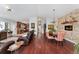Open concept living room with hardwood floors, dining area and access to the kitchen at 11398 Ranch Elsie Rd, Golden, CO 80403