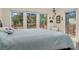 Main bedroom with beautiful views of the forest from the window and access to deck at 11398 Ranch Elsie Rd, Golden, CO 80403