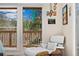 Bedroom with view, art and chair plus decor at 11398 Ranch Elsie Rd, Golden, CO 80403