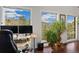 Bright home office with large windows offering views of the forest at 11398 Ranch Elsie Rd, Golden, CO 80403
