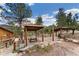 Inviting outdoor space featuring covered structures, perfect for relaxing and enjoying the natural surroundings at 11398 Ranch Elsie Rd, Golden, CO 80403