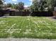 Large backyard featuring a newly mowed lawn and a sturdy wooden fence for privacy at 1455 S Tennyson St, Denver, CO 80219
