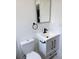 Contemporary bathroom with a sleek vanity, modern fixtures, and a minimalist design at 1455 S Tennyson St, Denver, CO 80219