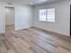 Stylish bedroom featuring modern wood floors, fresh white walls, and ample space at 1455 S Tennyson St, Denver, CO 80219
